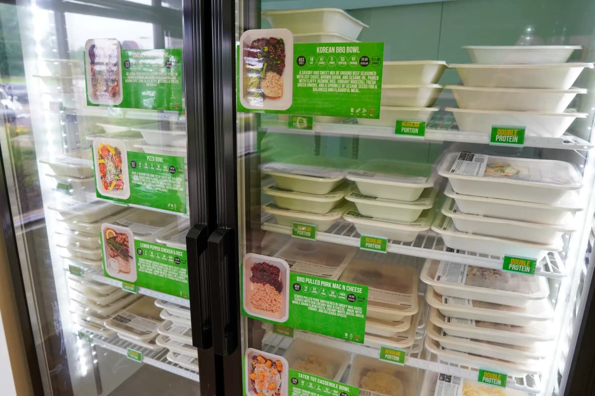 Smart cooler stocked with Simple Plan Foods meals — Korean BBQ, Lemon Pepper Chicken, Pizza Bowls and more