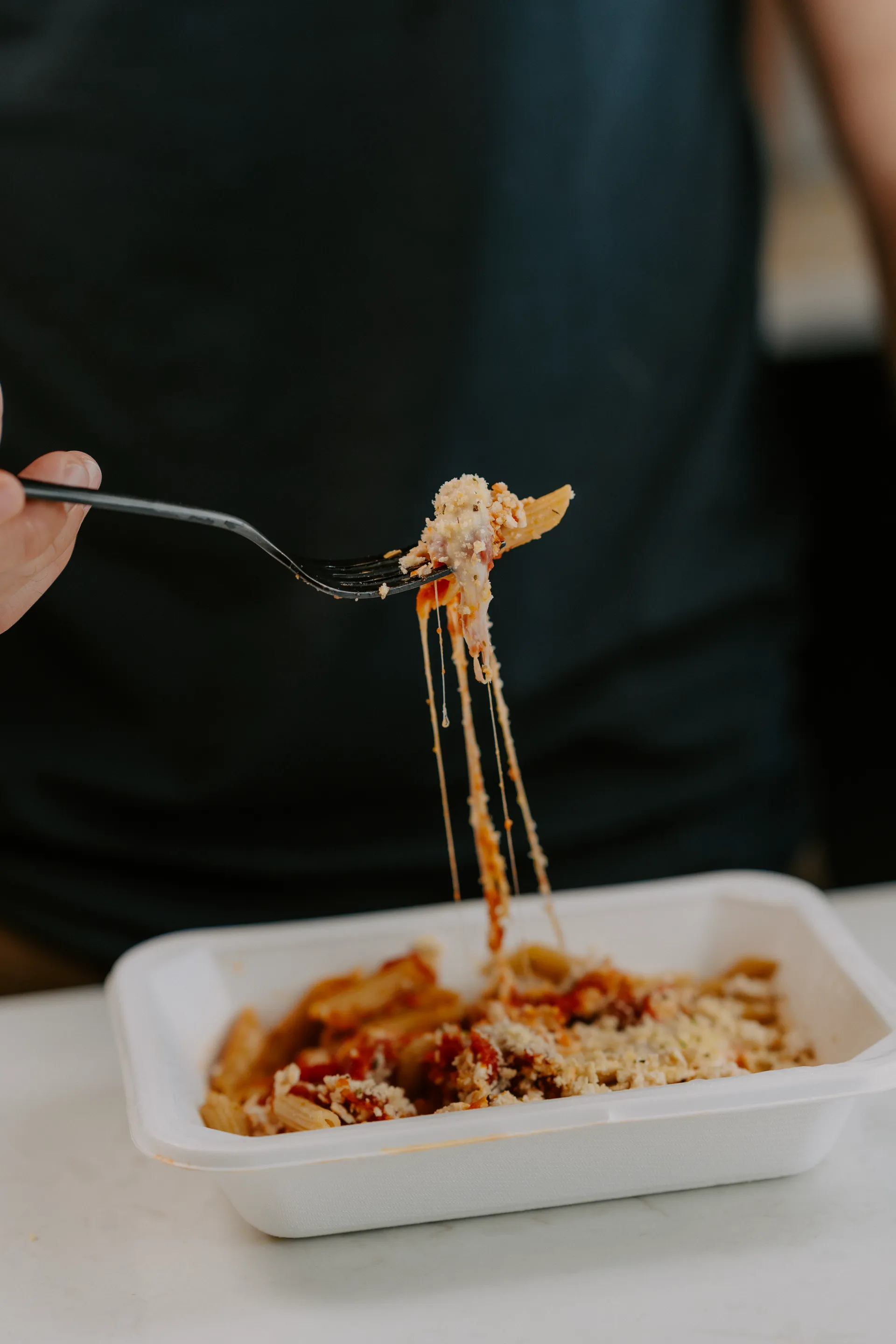 Baked penne with melted cheese
